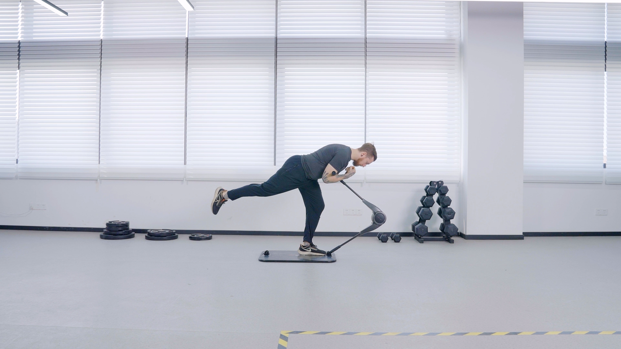 A man is using HooKee Smart Gym to deadlift as Glute-Activating Exercise